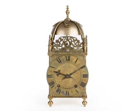 A 19th century brass lantern clock the dial with roman numerals engraved James Barron 16cm wide 40cm high  Clock is ticking a