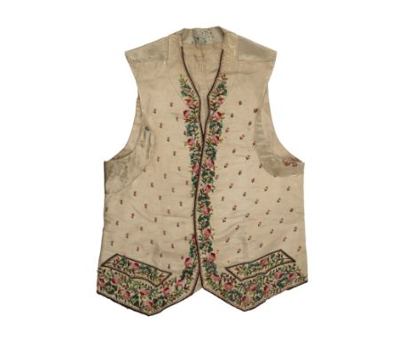 A Georgian silk embroidered waistcoat, decorated with flowers.  Stains, marks.  Fraying around button holes.  Other areas of 