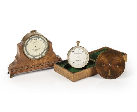 A Negretti &amp; Zambra travellers forecasting aneroid barometer and weather forecaster, each housed in a velvet lined pigski
