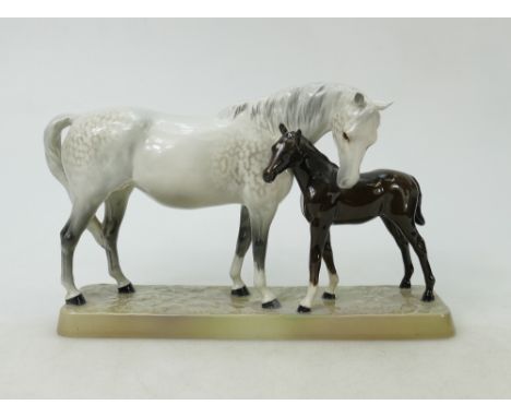 Beswick Mare and Foal on base: Beswick grey mare with dark brown foal on ceramic grass base model 1811.