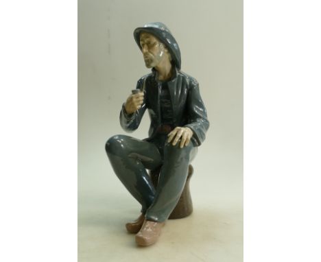 Large Nao Figure of Fisherman: Figure seated smoking a pipe height 38cm. 