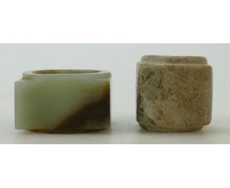 Two Neolithic style Jade Congs: A pale green jade with brown textured Cong and a small plain calcified Cong