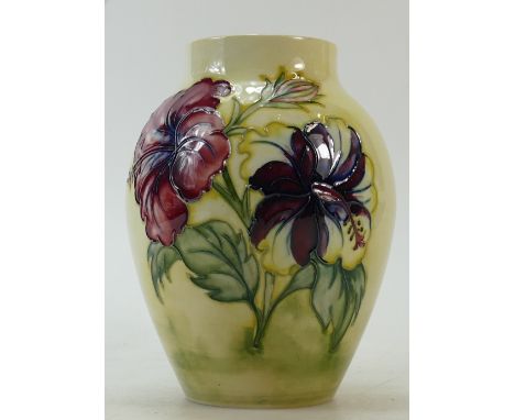 Walter Moorcroft Hibiscus Vase: Walter Moorcroft vase decorated in the Hibiscus design on light yellow ground, height 18cm.