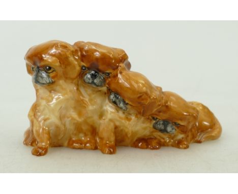 Royal Worcester miniature model of four Pekingese puppies: Royal Worcester early puce mark 3116, length 9.5cm. 