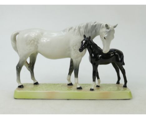 Beswick Mare and Foal on base: Beswick grey mare with black foal on ceramic grass base model 1811.