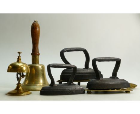 A vintage Iron with brass warming stand etc: Iron and brass warming stand together with two other irons, a large brass and wo