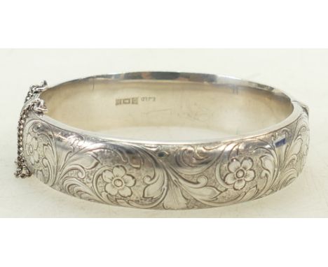Silver hallmarked Bangle: Hallmarked silver bangle, Internal dimensions 60mm x 57mm, x 16mm deep.  Gross weight 32g.