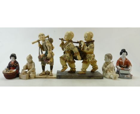 A collection of Japanese porcelain figures: Japanese seated pottery figures and resin double figure of two boys with bucket a