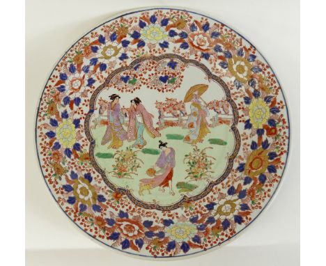 20th Century large Japanese Imari Charger: Decorated with Temple Garden scenes and Geisha at play, diameter 37cm