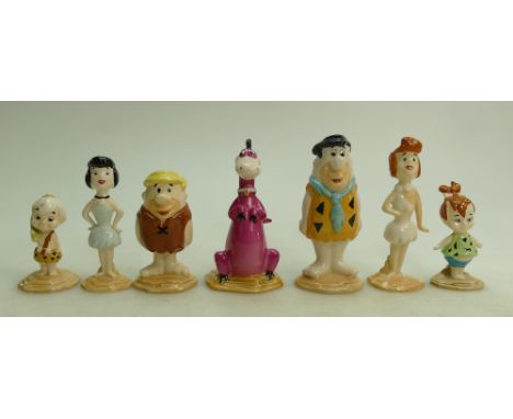 A collection of Beswick Flintstones figures: Fred and Wilma, Pebbles Flintstone, Barney and Betty, Bam Bam and Dino (7)