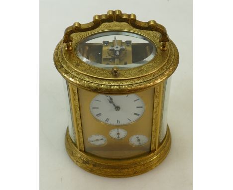 Large oval French Carriage Clock, quarter repeating, striking, alarm day and date: Large outstanding oval French engraved bra