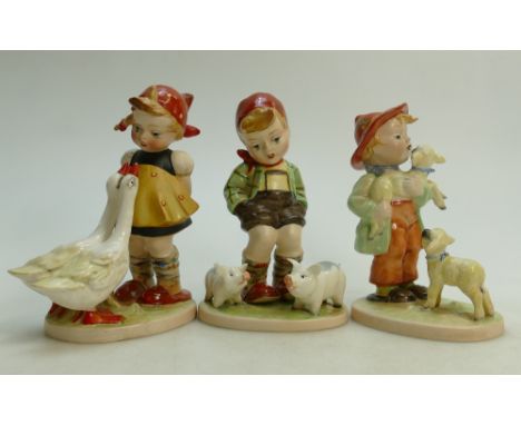 Beswick Hummel figures: Boy with Pig 912, Girl with Lamb 914 and  Girl with Goose (3)