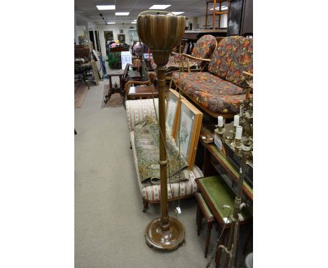 A 1920s mahogany lamp stand with a turned column