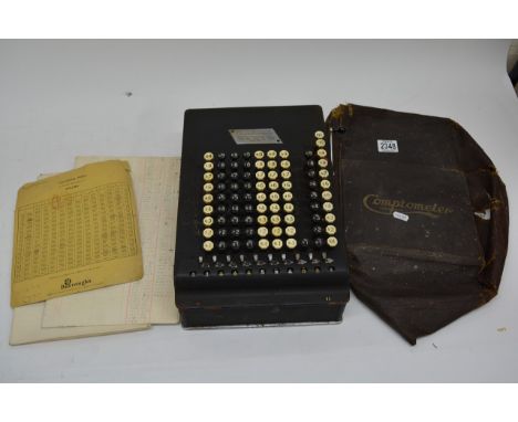 An early 20th century Comptometer counting machine with a vintage Bakelite hairdryer