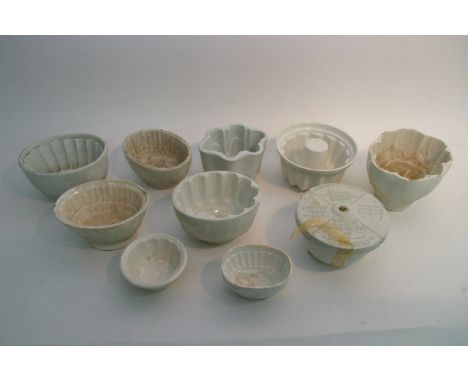 A collection of 11 ceramic jelly moulds