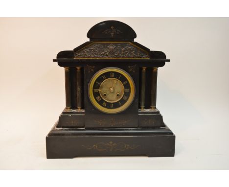 A Victorian slate mantel clock in classical form, circular dial with Roman numerals