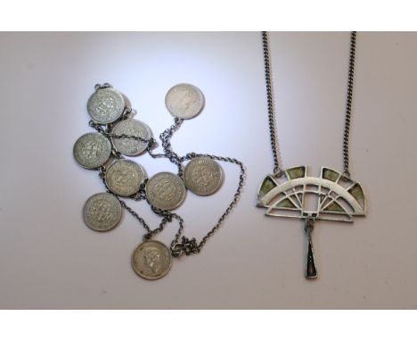 An Art Nouveau style silver Pat Cheney necklace and a coin necklace