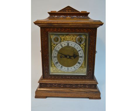 An Edwardian oak case chime mantel clock silvered chapter ring with roman numerals