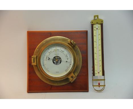 A brass, wood mounted Nauticalia barometer with another stick example