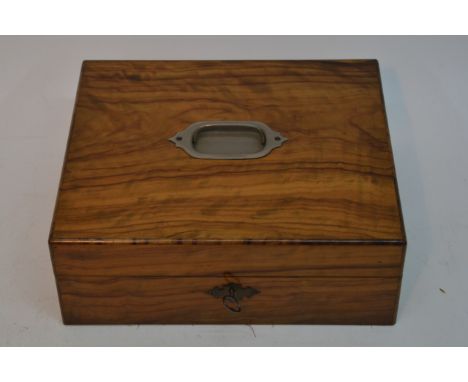 A walnut sewing box with tools including a bone pin cushion