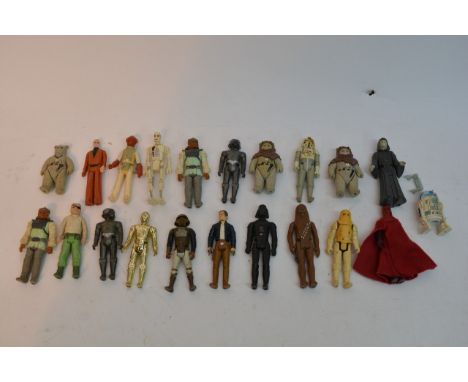 A collection of loose vintage Star Wars figures.