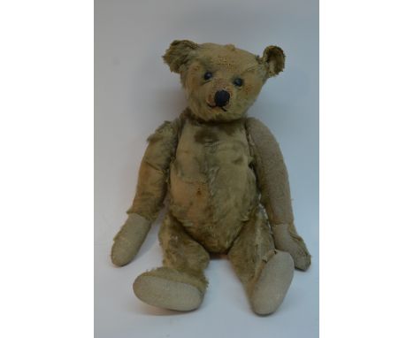 A vintage teddy bear, possibly a Steiff.