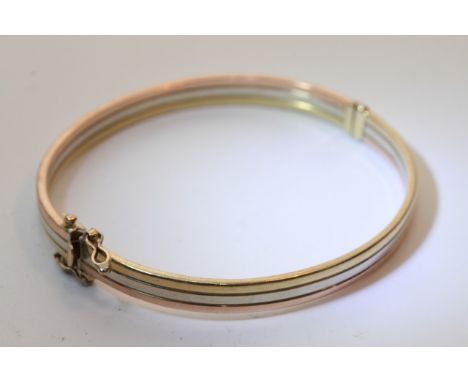A 9ct gold bangle with clasp