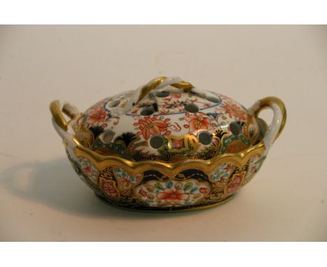 A fine quality 19th century Spode pot pourri, of oval shape painted and gilded in the 1216 Imari pattern