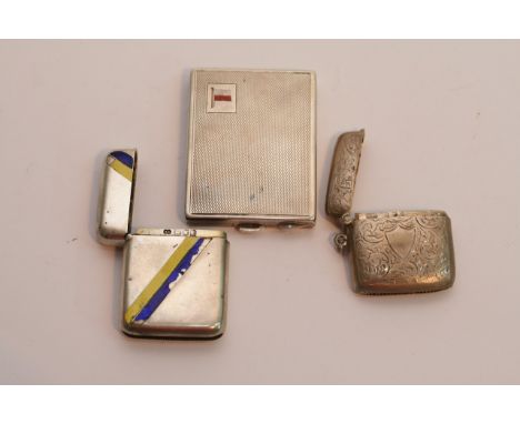 A silver compact Birmingham hallmarks with enamel decoration, and two silver vesta cases (30