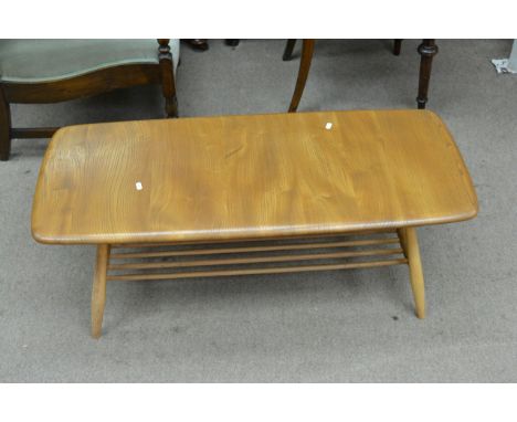 An Ercol light wood Windsor coffee table with undershelf