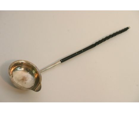 A silver toddy ladle with whale bone handle and a pewter wire funnel