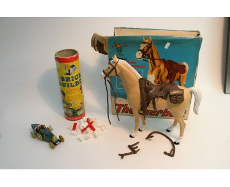A boxed Marx 'Thunderbolt Western Range Horse no.2061 together with tin of Merit Brickbuilder building blocks, set no.100, an