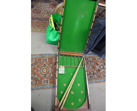 A vintage mahogany bar/bar billiards game with balls and accessories