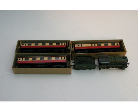 A boxed Trix Railway engine an tender together with 3 boxed carriages