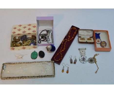 A small collection of costume jewellery and two silver and enamel badges