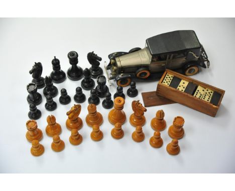 A collection of wooden chess pieces, bone dominoes and novelty radio in the form of a classic car (3).