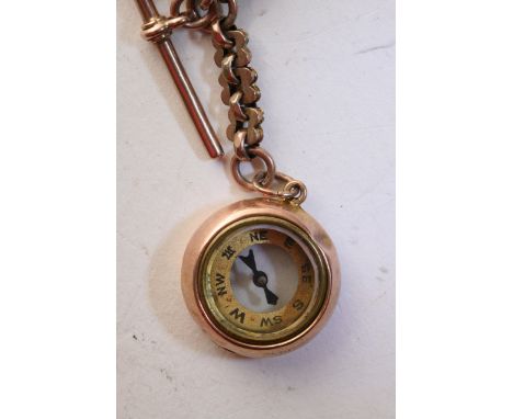 A 9ct gold watch chain with attached gold cased compass