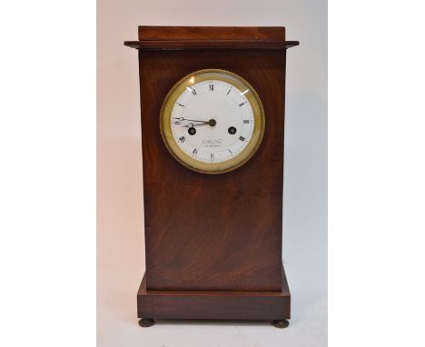 A French Second Empire mahogany cased mantel clock, the enamel dial maker Le Roy, with silk suspension