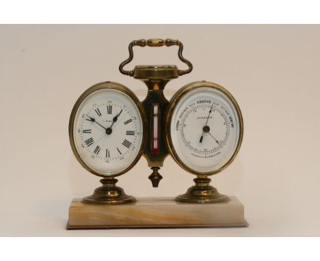 A brass twin mantle clock and barometer set with compass and thermometer, mounted on onyx base.Approximately 14cm wide