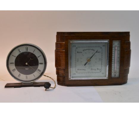 A Smiths Sectric bakelite clock and an oak cased barometer (2).