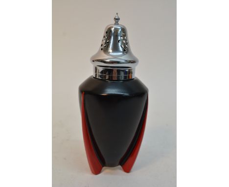 An Art Deco Wilkinson 'Yoo Hoo' pattern sifter having black body on red fin shaped feet with chrome lid and handle, design at