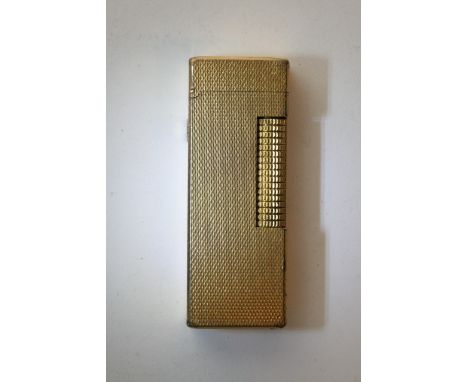 A gold plated Dunhill lighter
