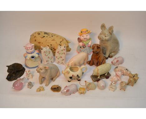 A box of various pigs comprising mainly ceramic examples including a Goebel pig.