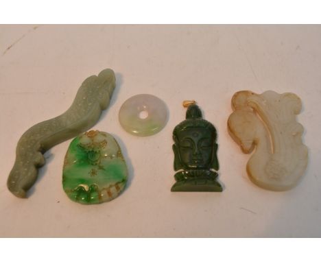 A collection of oriental pieces including carved jade oddments, amber style beads, a metalwork box and a collection of carved