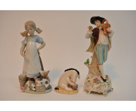 A Lladro figure of a girl with three kittens, a Sitzendorf figure of a boy with a basket of flowers and a Royal Doulton model