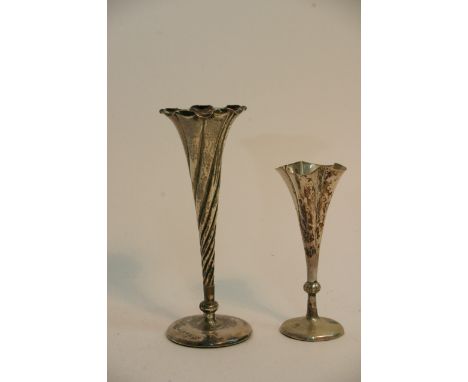 A silver trumpet posy vase with Chester hallmarks and one plated trumpet vase