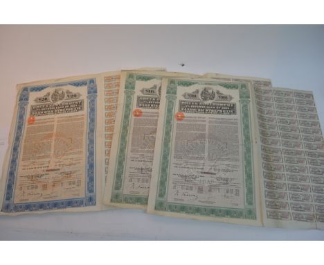 Thirteen assorted unframed bonds and stock certificates including 1920's Greece and Hungary examples plus a 1950 South Africa