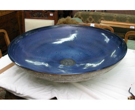 A large contemporary ceramic blue glazed dish, diameter 84cm