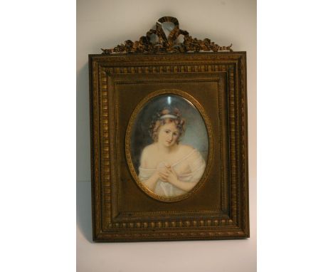 A fine quality portrait painting of a young woman, possibly on ivory, signed 'Laurius', mounted in classical frame, circa ear