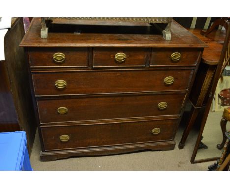 A large oak chest of drawers fitted with three drawers above three further drawers on bracket feet
